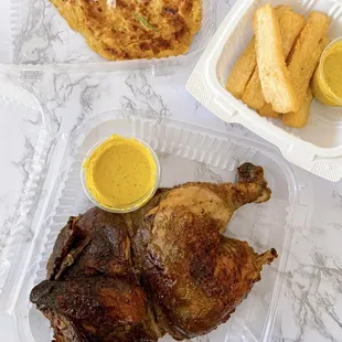 Pollo a la Brasa (Half-$15.95), Yucca Frita ($6.95), Tacu-Tacu: Peruvian Beans &amp; Rice ($9.95)
