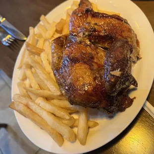 Half a pollo a la brasa with fries