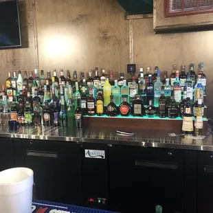 a bar full of alcohol bottles