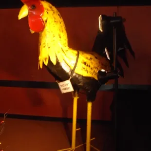 Chuck Norris the giant rooster - guarding the Christmas tree in back!