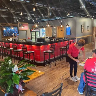 a group of people eating at a restaurant