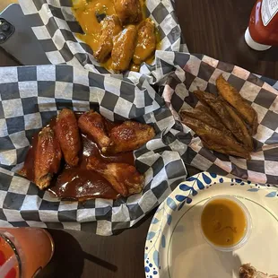 Buffalo/BBQ wings, Carolina gold wings, and fries.