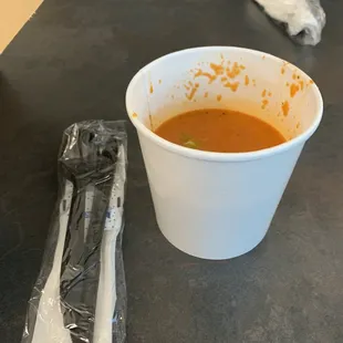 Takeout tomato soup that cost $9 for a tiny cup that was only half filled