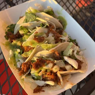 a plate of tacos on a table