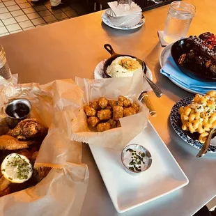 Fried chicken Brined in sweet tea, truffled tater tots, Mac and cheese, grits, and BBQ Brûléed Spare Ribs