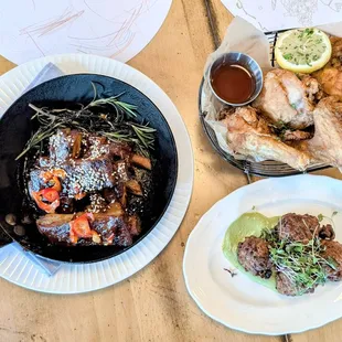 Barbecue Brûléed Spare Ribs, half rack; Fried Chicken Brined in Sweet Tea, half bird; and hush puppies with crab