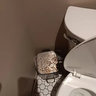 Rusted trash can.