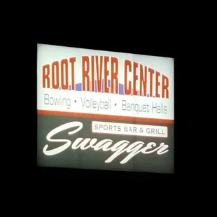 a sign for the root river center