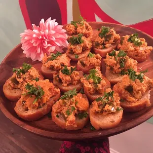Muffuletta Cashew Dip on crostinis