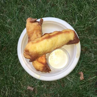 Mac &amp; cheese &quot;egg rolls&quot; with a mustard-like dipping sauce ($10)