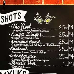 a menu for drinks on a blackboard