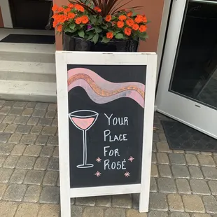 a sign with a glass of wine