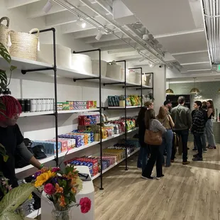 a group of people shopping in a store