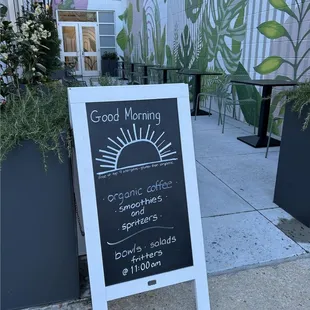 a sign for a good morning coffee shop