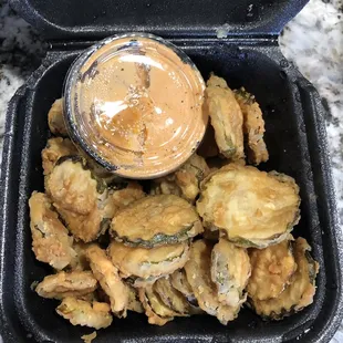 Fried pickles. Very yummy. Dipping sauce was SPICY!