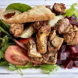 Regular size with souvlaki chicken, beets, tomatoes, cucumbers, onion, hummus and balsamic vinaigrette.