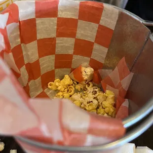 Popcorn brought to table to snack on while waiting for food!