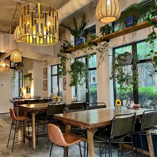 a dining area with a table and chairs