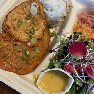 Veggie Kimchi pancake served with rice and salad.