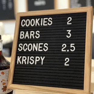 a menu board and a bottle of syrup