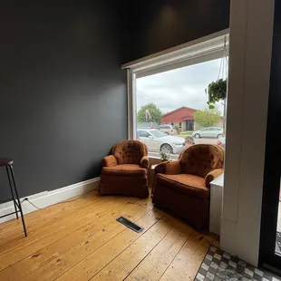 two chairs facing a window