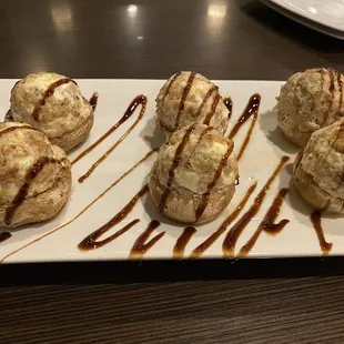 Stuffed mushrooms with sausage, cream cheese and a balsamic reduction.