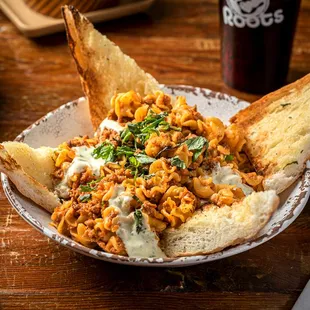 a bowl of pasta and bread