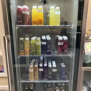 a fridge full of juices