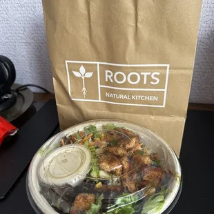 a salad in a paper bag