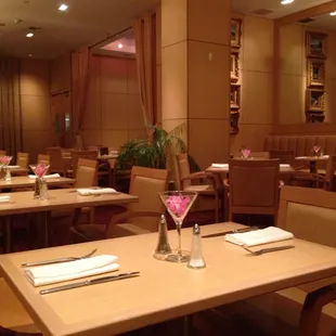 empty tables and chairs in a restaurant