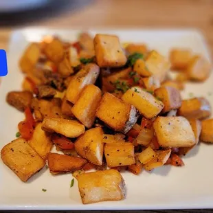 a plate of potatoes on a table