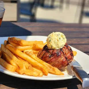 a steak and fries on a plate
