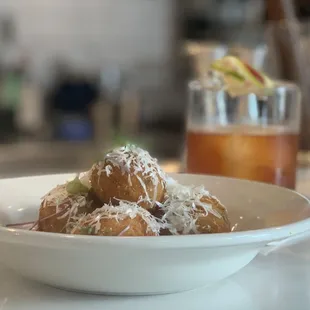 A "La Fresa Surena" to wash down the most sinful Fried Shrimp and Grits up at the bar top!