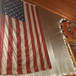 an american flag hanging from the ceiling
