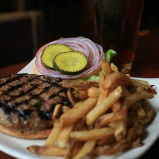 a hamburger and fries on a plate