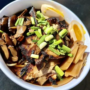 a bowl of noodles and meat