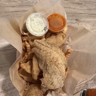 a basket of fried fish and chips