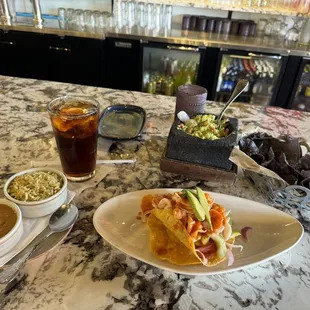 Ceviche tostada, cilantro lime rice with refried beans and the guacamole appetizer.