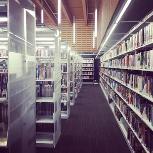 Transparent shelves. Beautiful wood beams. Tres modern but cheerful and fun and sophisticated at the same time!
