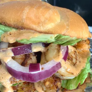 Seafood Slider - blackened shrimp &amp;  lobster on top a lump crab cake on a toasted Brioche Roll drizzled with our signature sauce.