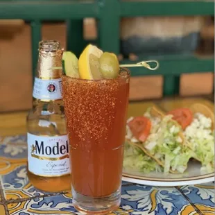 a drink and a plate of salad