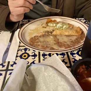 My husband plate chimmcounga  dinner with no rice double beans.