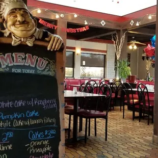 a restaurant with tables and chairs
