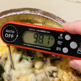 a digital thermometer in a pie