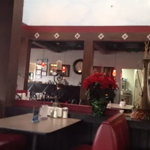 Part of the seating area -  colorful, a little worn, decorated from an eclectic view point, somewhat dimly lit.