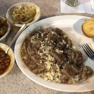 Beef tips with rice and gravy, fried okra, baked beans, and cornbread.