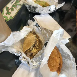 Steak egg and cheese taco. Chicken empanada. Veggie taco