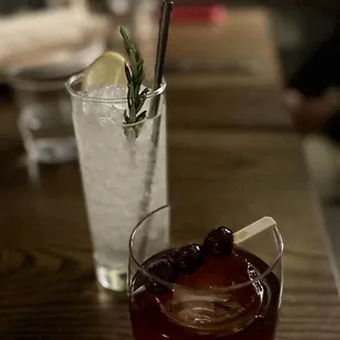a close up of a glass of wine with a garnish