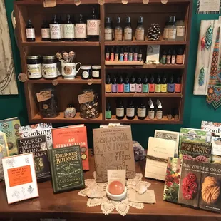 a table with books, candles, and other items
