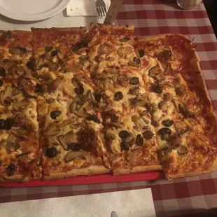 Large 12 cut with sausage, mushrooms and black olives.